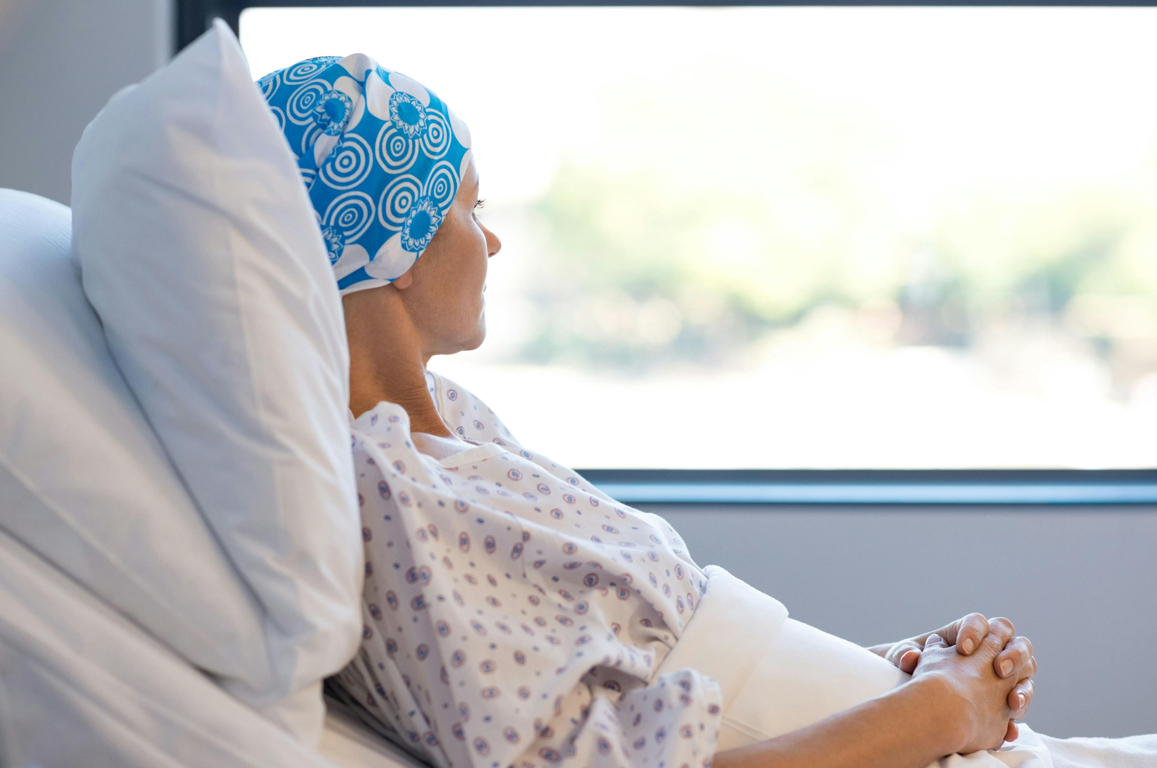 woman with cancer in a hospital bed