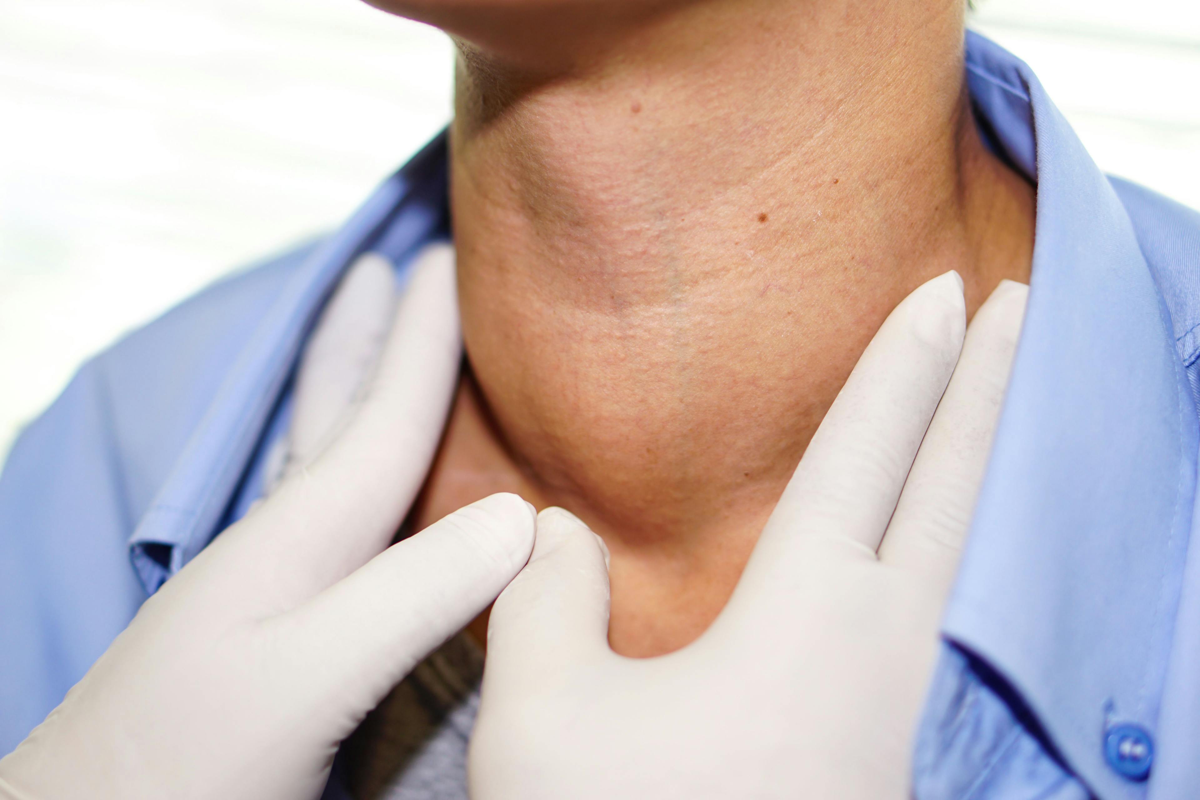 provider feeling for nodes on patient neck