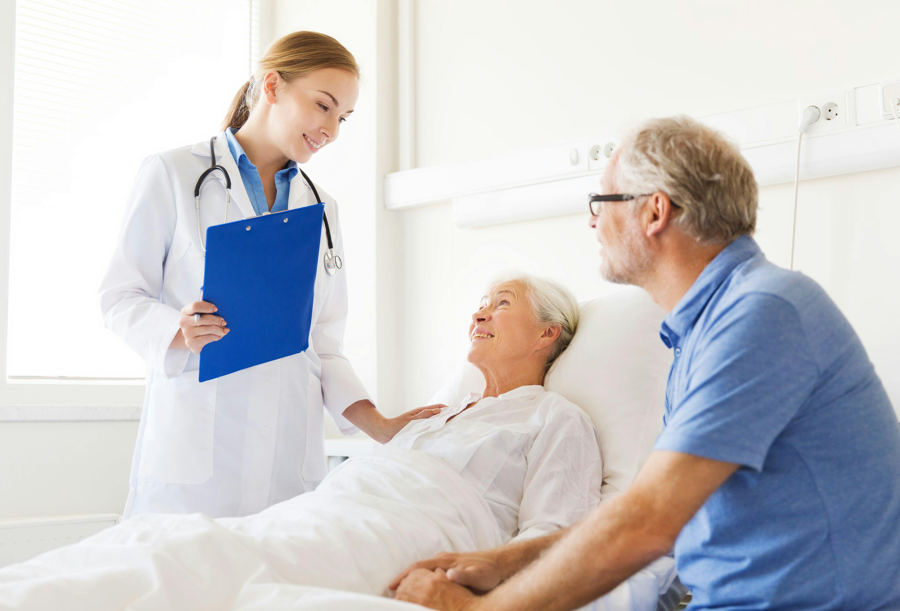 patient with physician and caregiver